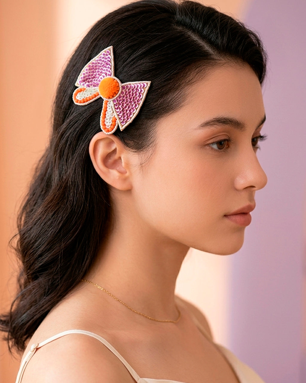 Bow Shaped Hair Clip With Orange Pompom