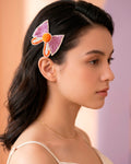 Bow Shaped Hair Clip With Orange Pompom