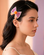 Bow Shaped Hair Clip With Orange Pompom