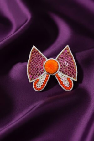 Bow Shaped Hair Clip With Orange Pompom